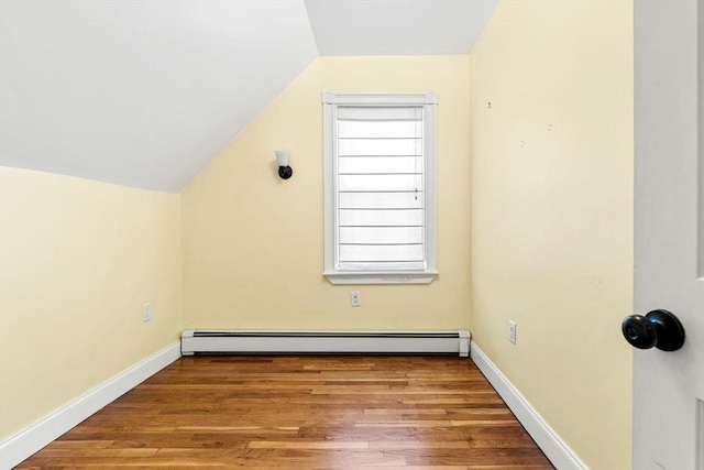 24 Willard St, Malden, MA 02148 - additional living space with a baseboard radiator, lofted ceiling, and wood finished floors