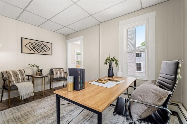 24 Willard St, Malden, MA 02148 - office featuring a baseboard radiator, a paneled ceiling, wood finished floors, and a decorative wall