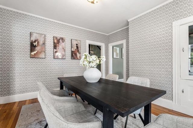 24 Willard St, Malden, MA 02148 - dining room with ornamental molding, wood finished floors, and wallpapered walls