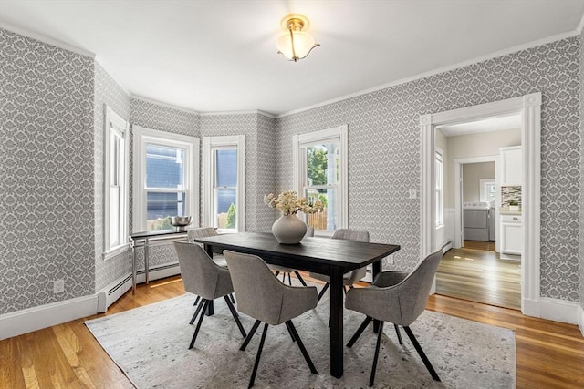 24 Willard St, Malden, MA 02148 - dining space featuring wallpapered walls, crown molding, and light wood finished floors