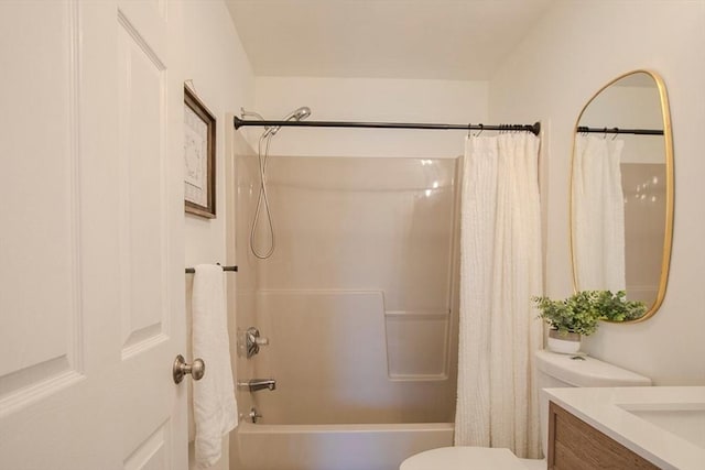 full bathroom with vanity, toilet, and shower / tub combo