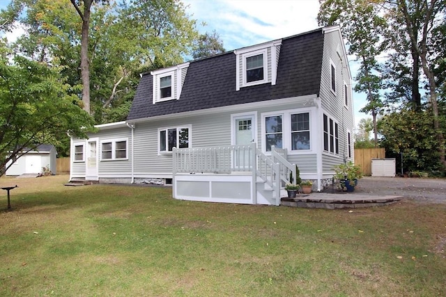 16 Norfolk St, Lakeville, MA 02347 - colonial inspired home featuring a gambrel roof, roof with shingles, entry steps, and a front yard