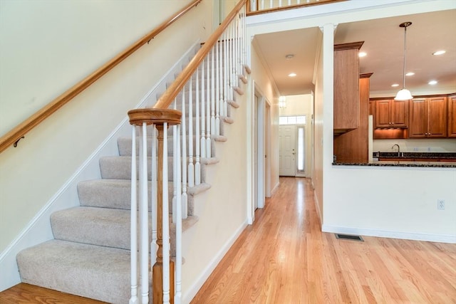12 Braeburn Ln Unit 12, Ashland, MA 01721 - stairs featuring wood finished floors and recessed lighting