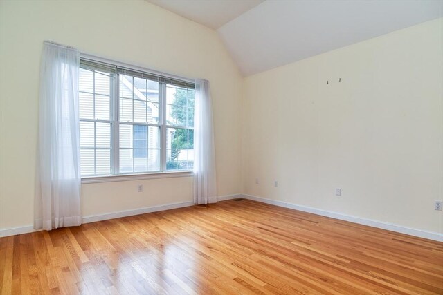 12 Braeburn Ln Unit 12, Ashland, MA 01721 - spare room with light wood-type flooring and lofted ceiling