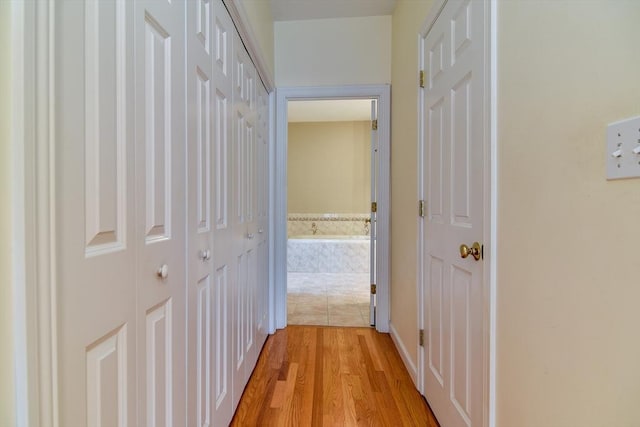 12 Braeburn Ln Unit 12, Ashland, MA 01721 - corridor featuring light wood-style floors