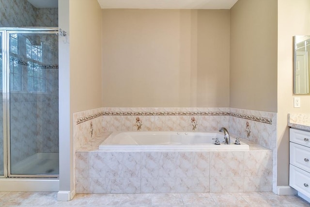 12 Braeburn Ln Unit 12, Ashland, MA 01721 - bathroom with vanity, a bath, a shower stall, and tile patterned flooring