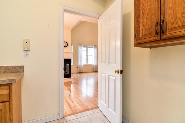 12 Braeburn Ln Unit 12, Ashland, MA 01721 - hallway featuring lofted ceiling and light tile patterned floors