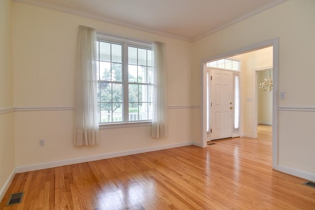 12 Braeburn Ln Unit 12, Ashland, MA 01721 - entryway featuring plenty of natural light, light wood finished floors, crown molding, and a chandelier