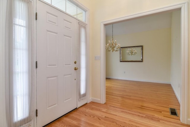 12 Braeburn Ln Unit 12, Ashland, MA 01721 - foyer featuring light wood finished floors and a chandelier
