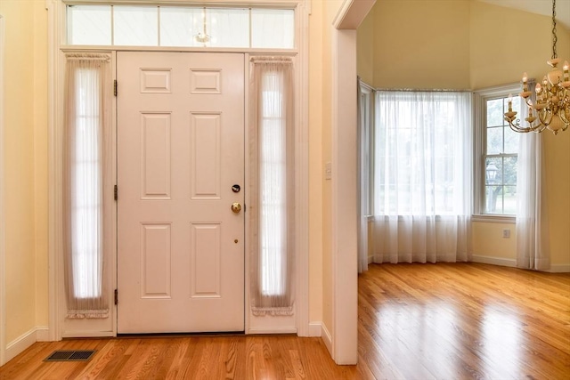 12 Braeburn Ln Unit 12, Ashland, MA 01721 - foyer entrance featuring a chandelier and light wood-style flooring