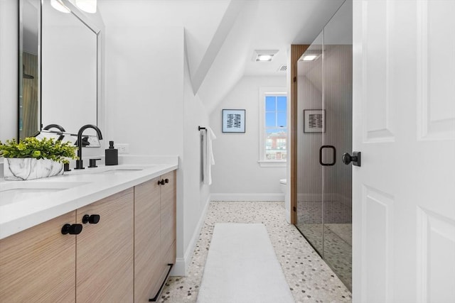 bathroom with vanity, tile patterned floors, a shower with door, and toilet