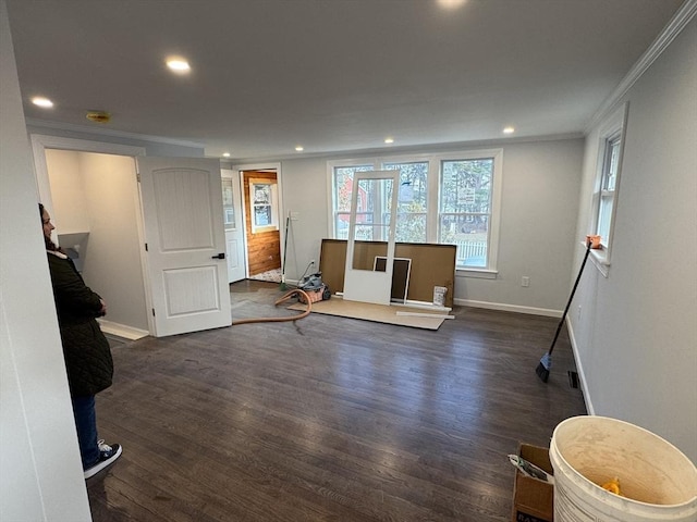 living room with dark hardwood / wood-style flooring and crown molding