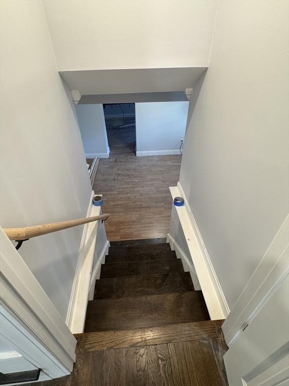 stairway with wood-type flooring