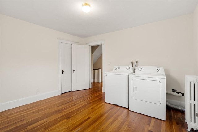 8 Warren Rd, Marblehead, MA 01945 - washroom with washer and dryer, radiator heating unit, hardwood / wood-style flooring, and baseboards