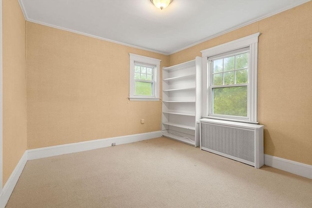 8 Warren Rd, Marblehead, MA 01945 - carpeted empty room with radiator, ornamental molding, and baseboards