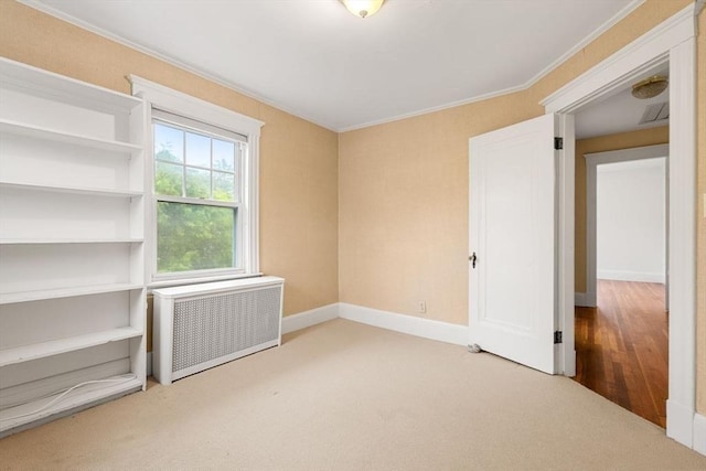 8 Warren Rd, Marblehead, MA 01945 - unfurnished bedroom with radiator, carpet, ornamental molding, and baseboards