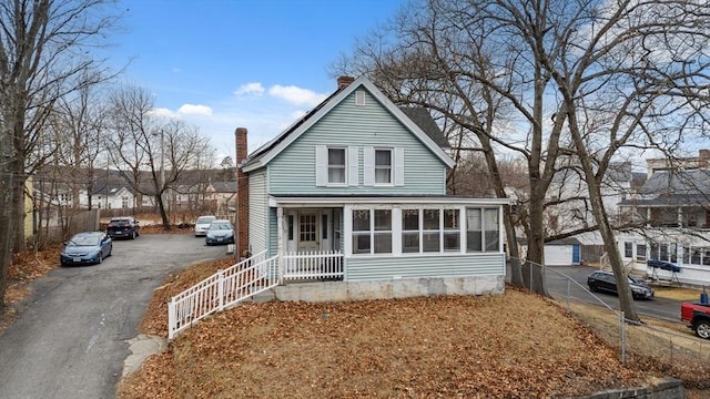 view of front of home featuring a sunroom