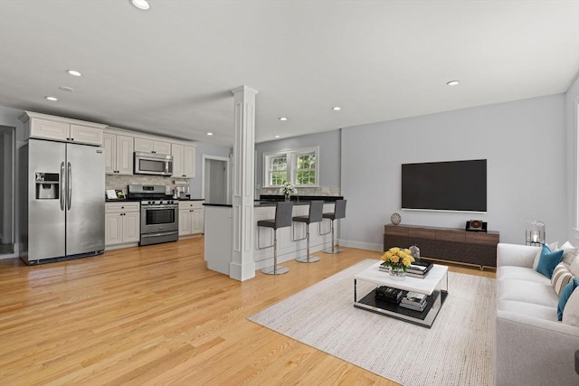 328 N Main St, Sharon, MA 02067 - living area featuring light wood-type flooring and recessed lighting