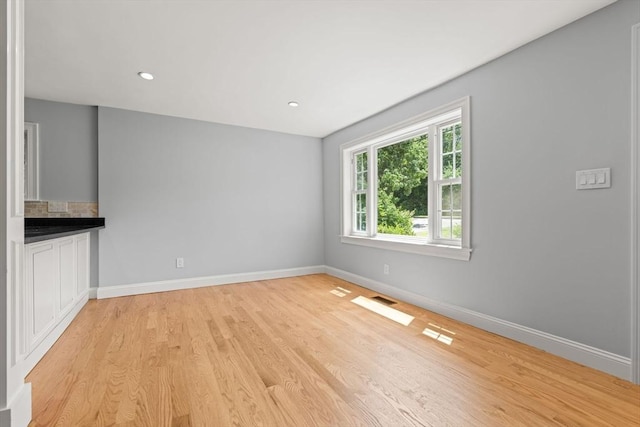 328 N Main St, Sharon, MA 02067 - unfurnished living room with light wood-style flooring and recessed lighting