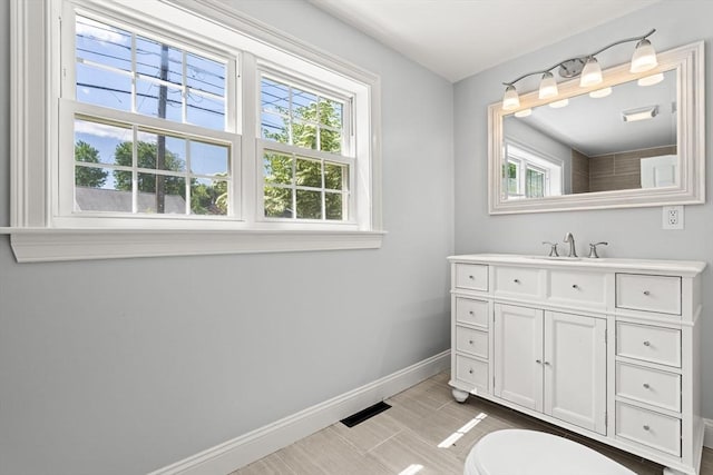 328 N Main St, Sharon, MA 02067 - bathroom with baseboards and vanity