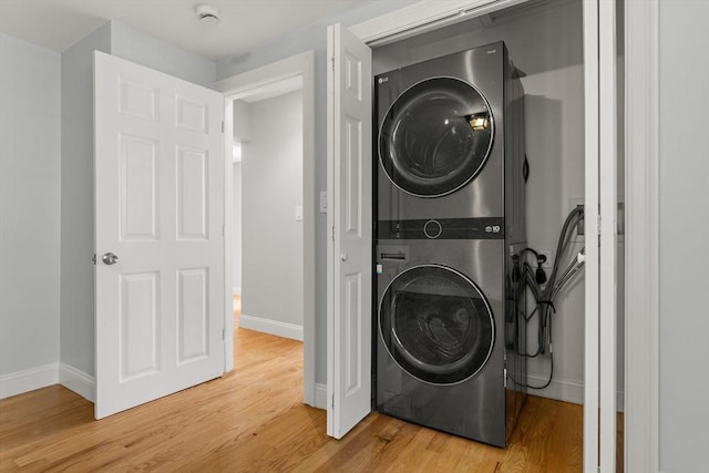 328 N Main St, Sharon, MA 02067 - laundry room with estacked washer and dryer and light wood-style flooring