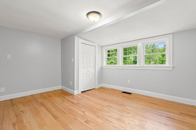 328 N Main St, Sharon, MA 02067 - unfurnished bedroom with light wood finished floors, lofted ceiling, and a closet