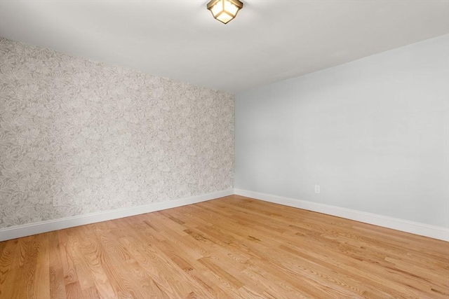 328 N Main St, Sharon, MA 02067 - unfurnished room with light wood finished floors and wallpapered walls