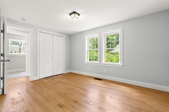 328 N Main St, Sharon, MA 02067 - unfurnished bedroom with light wood-style flooring and a closet