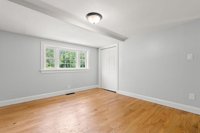 328 N Main St, Sharon, MA 02067 - unfurnished bedroom with light wood finished floors and a closet