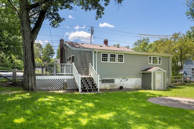 328 N Main St, Sharon, MA 02067 - back of house featuring a wooden deck, a lawn, and a storage unit