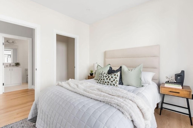 bedroom featuring wood finished floors