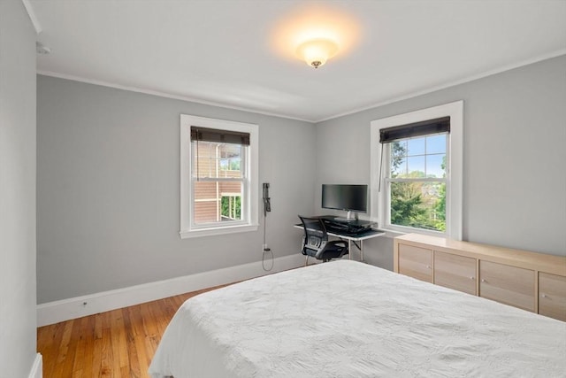 30 Gilbert Rd Unit 30, Belmont, MA 02478 - bedroom with ornamental molding, baseboards, and wood finished floors