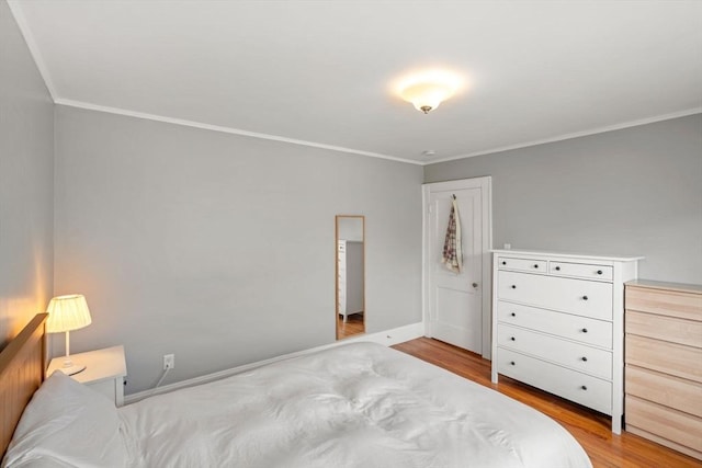30 Gilbert Rd Unit 30, Belmont, MA 02478 - bedroom featuring wood finished floors, ornamental molding, and baseboards