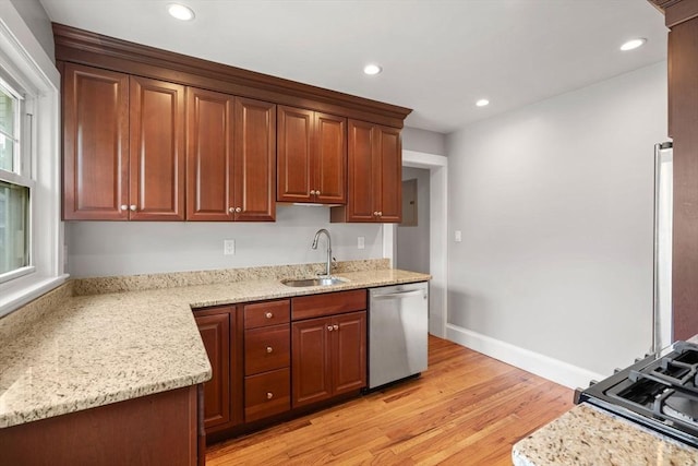 30 Gilbert Rd Unit 30, Belmont, MA 02478 - kitchen with stainless steel dishwasher, a sink, light wood-type flooring, light stone countertops, and recessed lighting