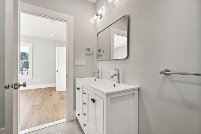 bathroom with vanity and tile patterned floors