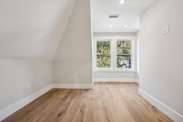 bonus room with light wood-type flooring