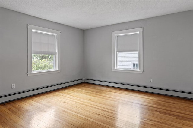 17-19 Maple St, Newton, MA 02466 - unfurnished room featuring wood-type flooring and a textured ceiling