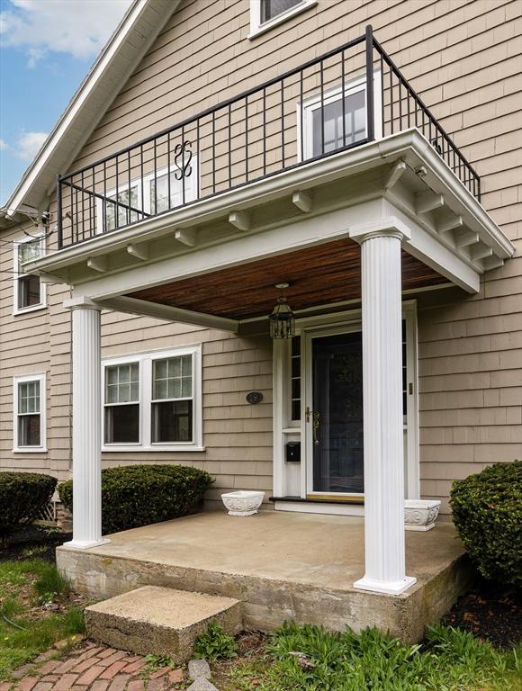 17-19 Maple St, Newton, MA 02466 - view of exterior entry with a balcony and covered porch