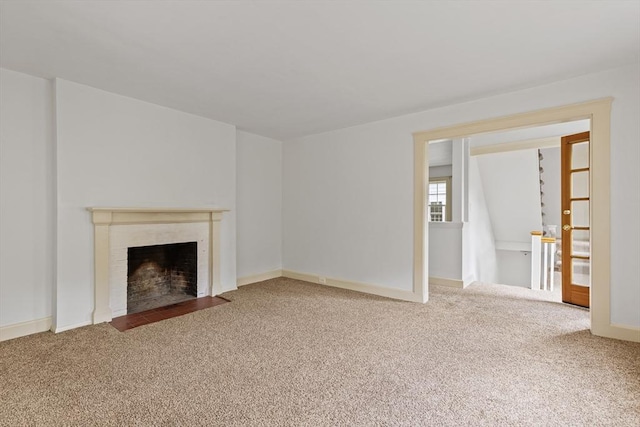 17-19 Maple St, Newton, MA 02466 - unfurnished living room with carpet, a fireplace with flush hearth, and baseboards