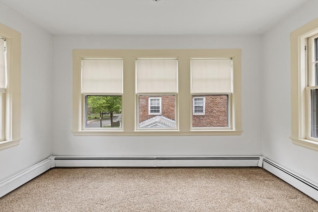 17-19 Maple St, Newton, MA 02466 - carpeted spare room with a baseboard radiator