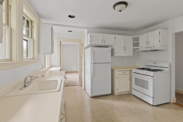 17-19 Maple St, Newton, MA 02466 - kitchen featuring white appliances, under cabinet range hood, a sink, recessed lighting, and white cabinets