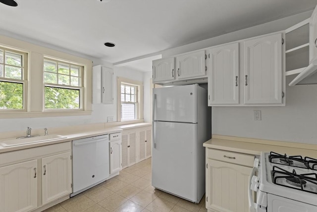 17-19 Maple St, Newton, MA 02466 - kitchen featuring white appliances, a sink, white cabinetry, and light countertops