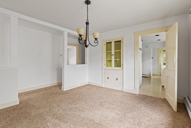 17-19 Maple St, Newton, MA 02466 - unfurnished dining area featuring carpet, a chandelier, a baseboard heating unit, and baseboards