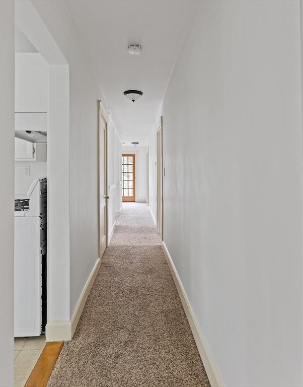 17-19 Maple St, Newton, MA 02466 - corridor featuring light carpet and baseboards