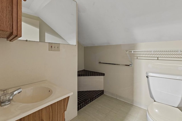 17-19 Maple St, Newton, MA 02466 - bathroom with vaulted ceiling, toilet, and vanity