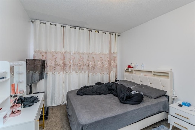 bedroom featuring a textured ceiling