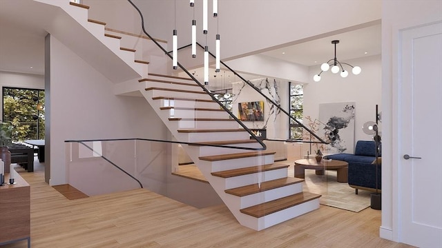 51 Willard Rd, Weston, MA 02493 - staircase with wood finished floors, a towering ceiling, a chandelier, and recessed lighting