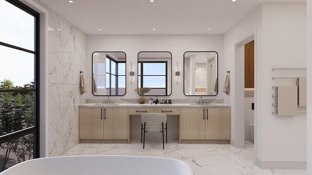 51 Willard Rd, Weston, MA 02493 - full bathroom featuring marble tiled flooring, a freestanding bath, double vanity, and recessed lighting