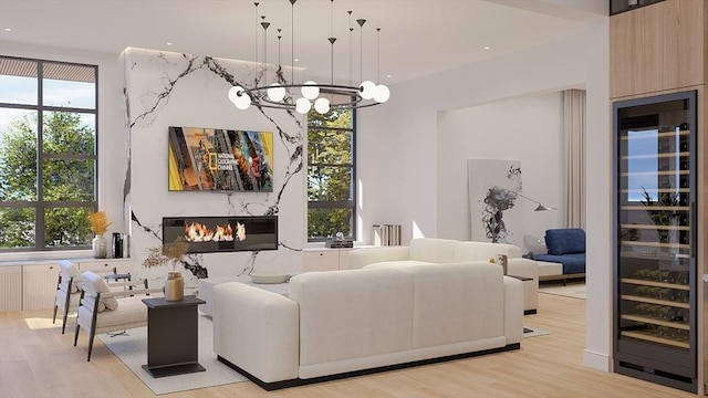 51 Willard Rd, Weston, MA 02493 - living room with wine cooler, a chandelier, and light wood finished floors