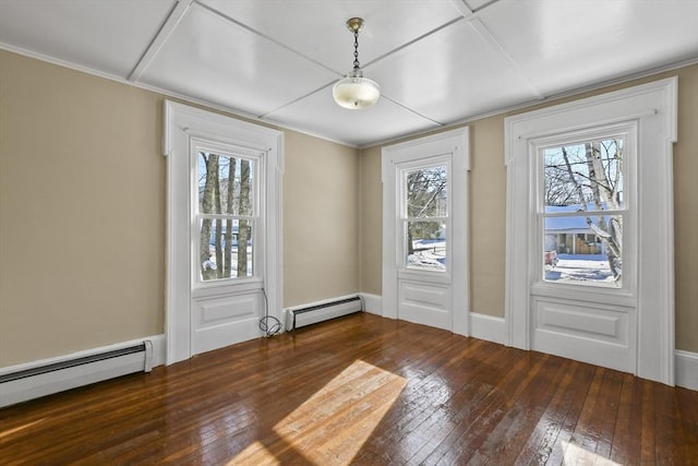 interior space with a baseboard heating unit and dark hardwood / wood-style floors